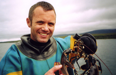 Scuba diver and hand caught lobster